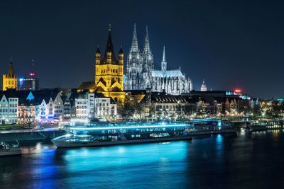 View of illuminated buildings at waterfront