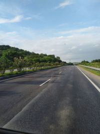 Empty road against sky