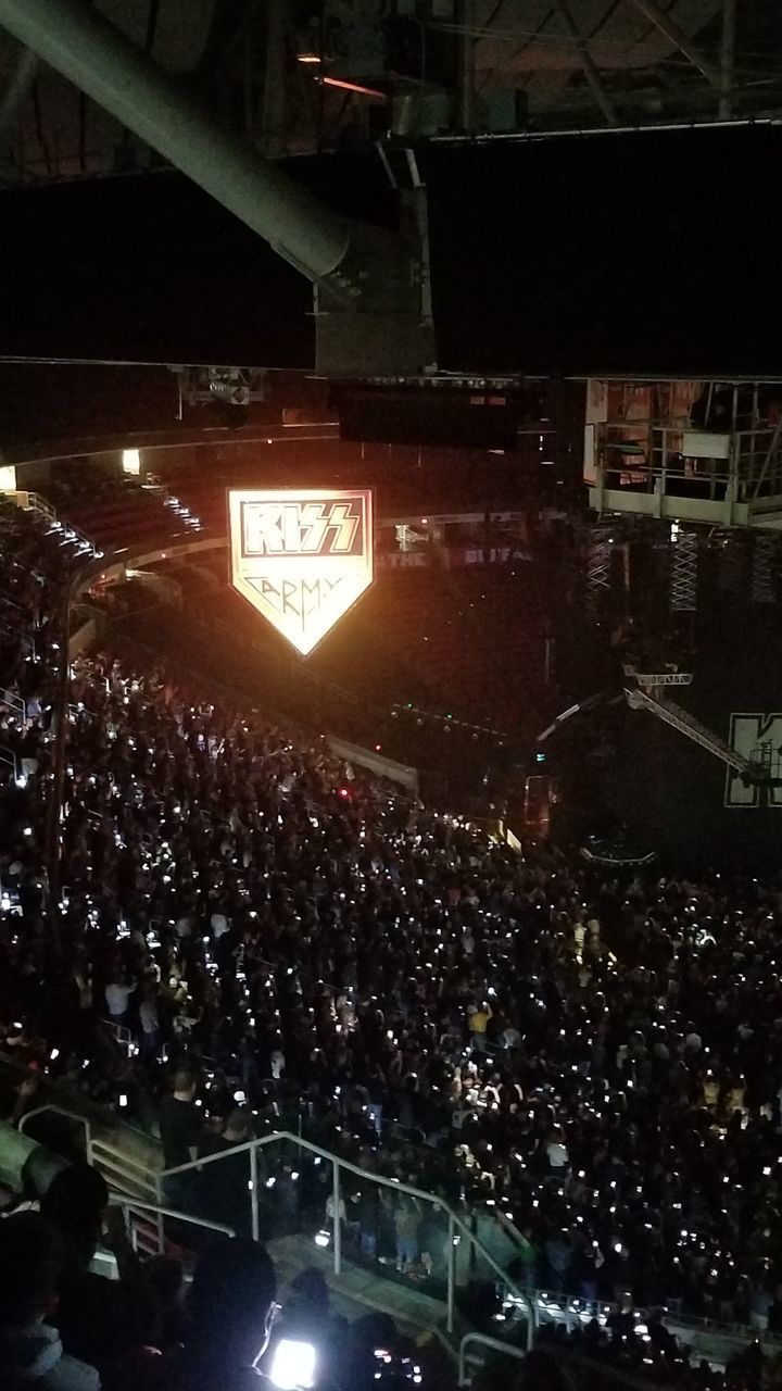 HIGH ANGLE VIEW OF CROWD AT ILLUMINATED CITY AT NIGHT