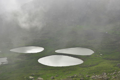 High angle view of lake in foggy weather