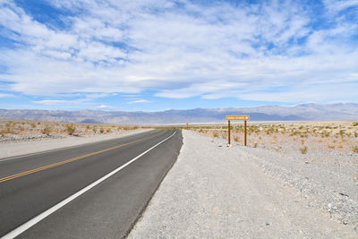 Empty road along landscape