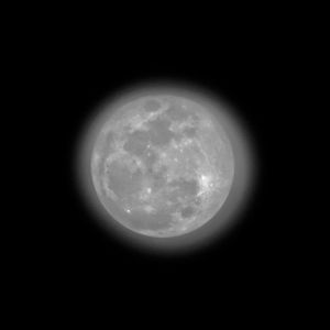 Low angle view of moon against sky at night