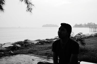 Man on beach against sky