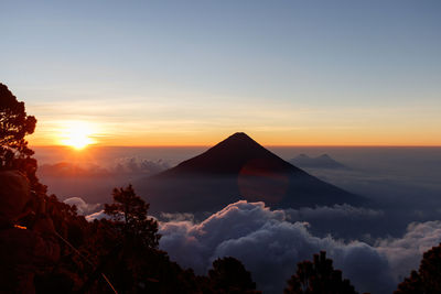 Scenic view of mountains against sky during sunset