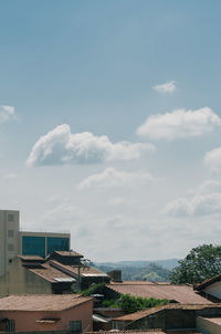 High angle view of houses by sea against sky