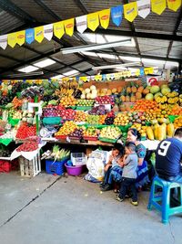 Group of people at market stall