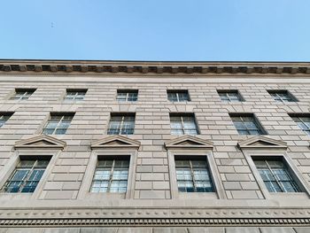 Low angle view of building against clear blue sky