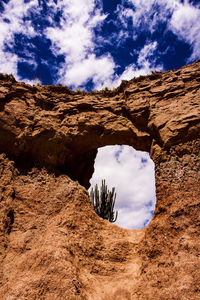 Low angle view of rock formation against sky