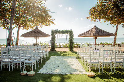 Gazebo on beach against sky