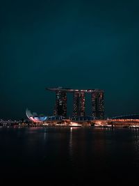 Illuminated buildings at waterfront