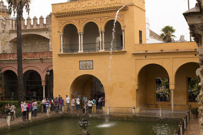 Tourists in front of building