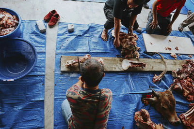 High angle view of people standing at market