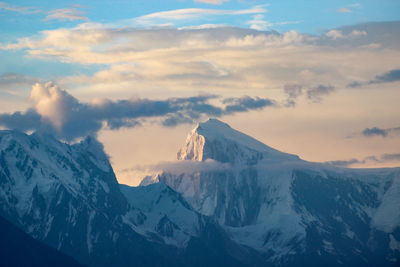 Scenic view of snowcapped mountains against sky