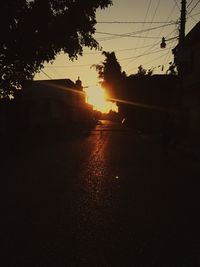 Silhouette trees against sky during sunset