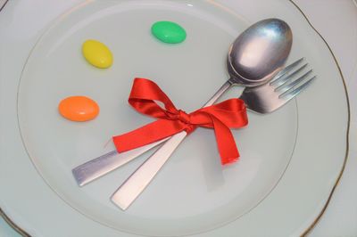 High angle view of tomatoes in plate on table