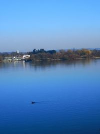 Scenic view of lake against blue sky