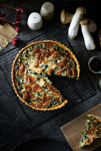 High angle view of pizza on cutting board