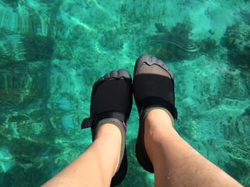 Low section of woman in water