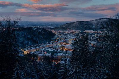 Aerial view of townscape against sky during winter