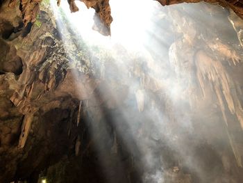 Low angle view of rock formation against sky