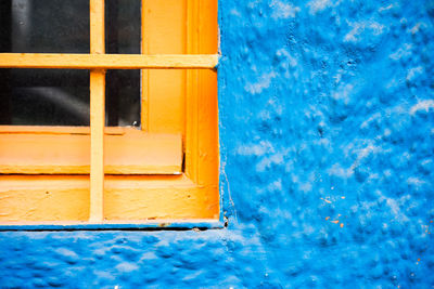 Close-up of window by wall outdoors