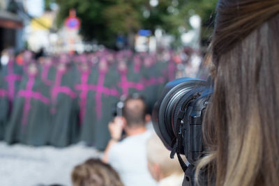 Rear view of people photographing