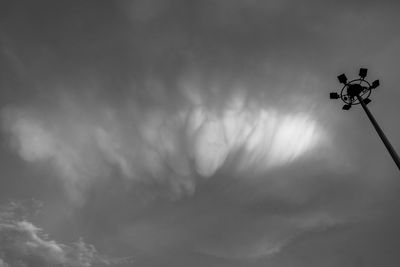 Low angle view of silhouette street light against sky