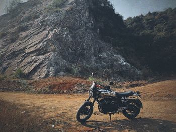 Man riding motorcycle on field