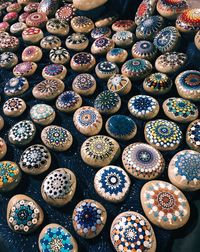 High angle view of multi colored stones for sale at market stall