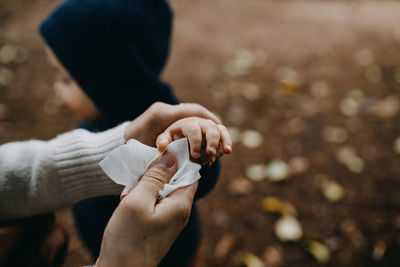 Close-up of man holding hands