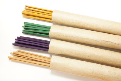 Close-up of colored pencils against white background