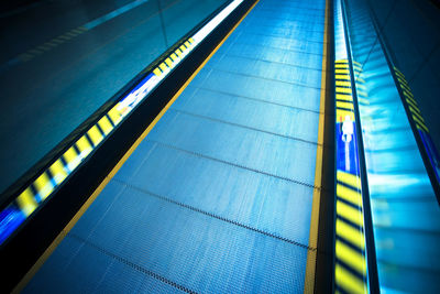 High angle view of illuminated escalator at subway station