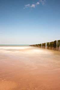 Scenic view of beach against clear sky