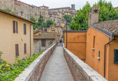 Alley amidst buildings in city