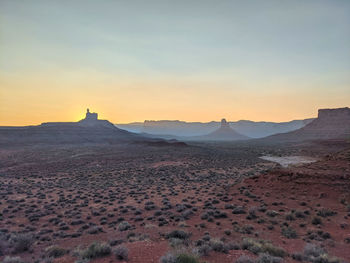 View of desert against sky during sunset