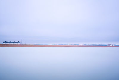 Scenic view of sea against sky during winter