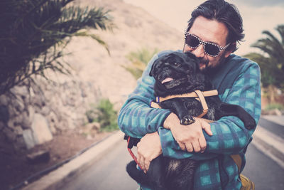 Man with dog on street
