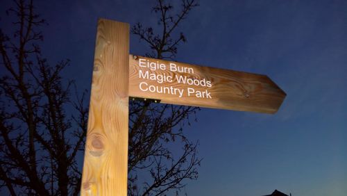 Low angle view of information sign against sky