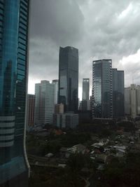 Modern buildings in city against sky