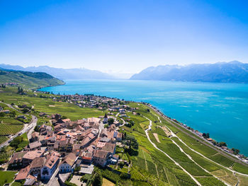 High angle view of sea and buildings against sky