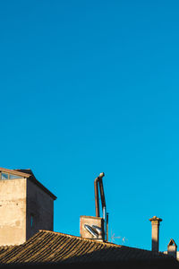 Low angle view of building against blue sky