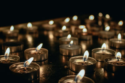 Close-up of illuminated tea light candles
