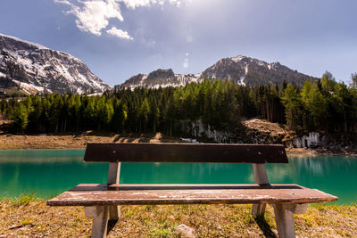 Scenic view of swimming pool by lake against sky