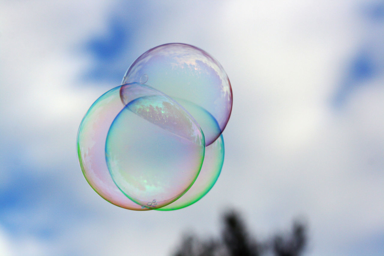 LOW ANGLE VIEW OF BUBBLES IN SKY