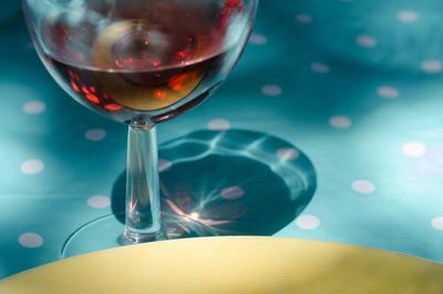 High angle view of red wine in glass on table