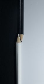 High angle view of pencil on table against white background