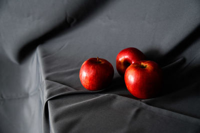 High angle view of apples on bed