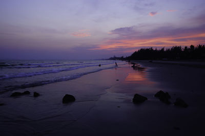 Scenic view of sea against sky at sunset