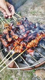 Close-up of skewers on barbecue grill