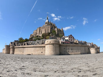 Low angle view of old ruins against sky